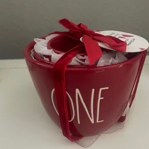 Rae Dunn Valentine’s Day red measuring cups with heart cutout.